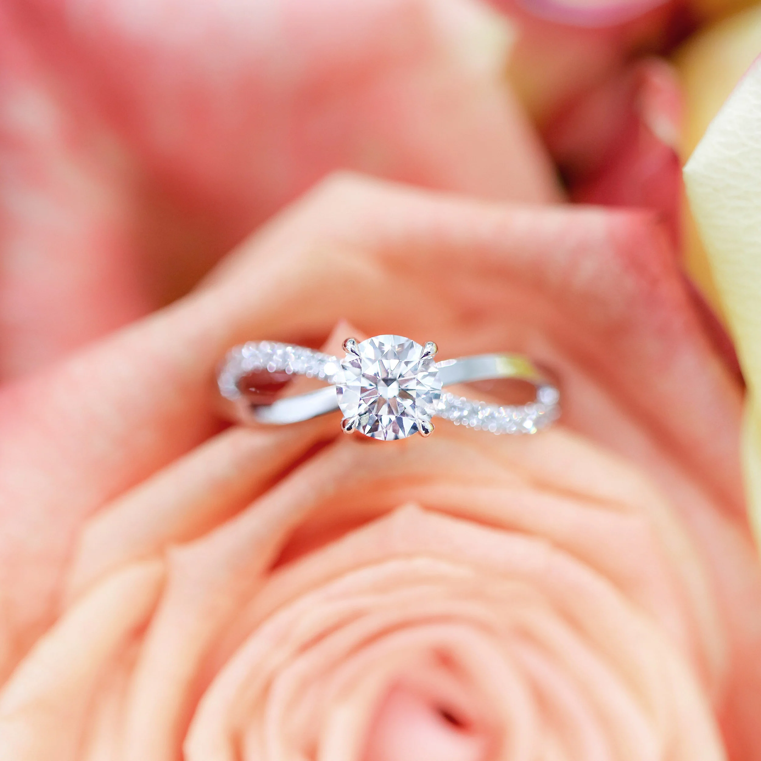 18k White Gold 1 Carat Round Lab Diamond Infinity Twist Band Engagement Ring Ada Diamonds Design AD-154 Floral Background