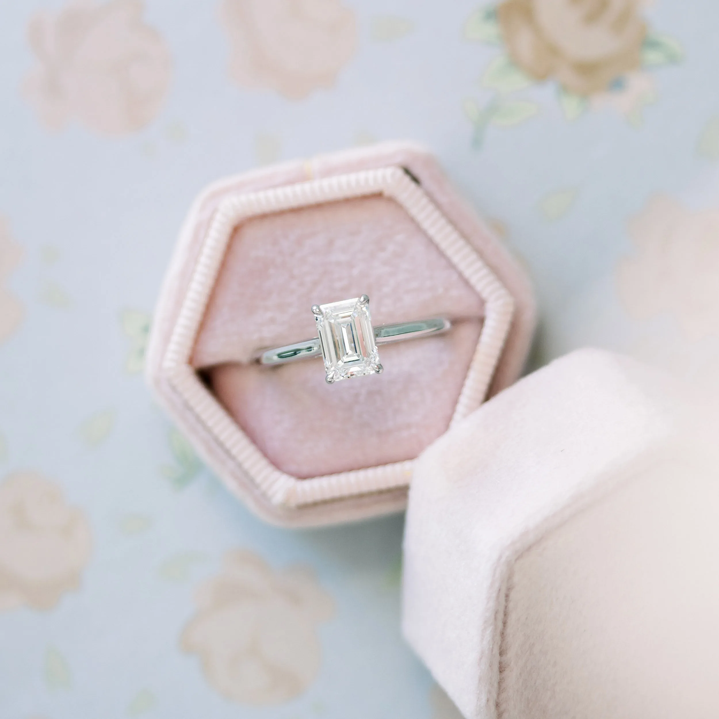 white gold trellis solitaire with emerald cut