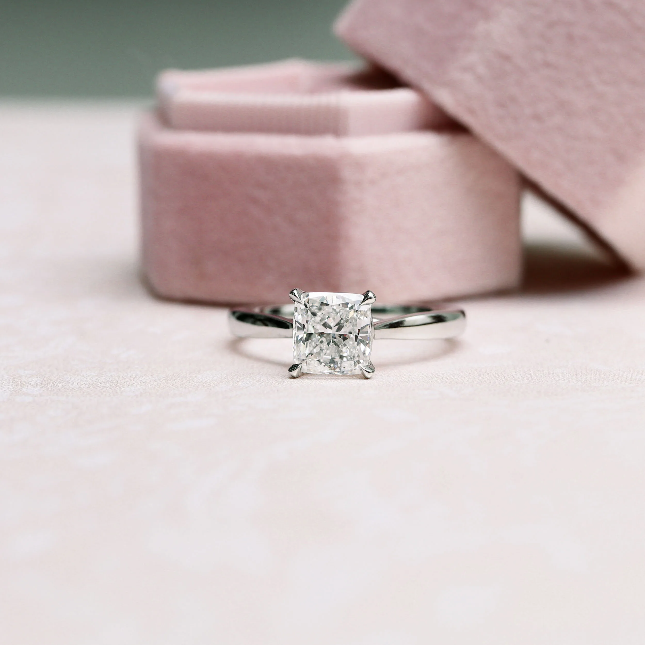 Platinum 1.5 Carat Cushion Cut Open Cathedral Solitaire Lab Diamond Engagement Ring with Tapered Band Ada Diamonds Design Number AD-147 Macro Shot