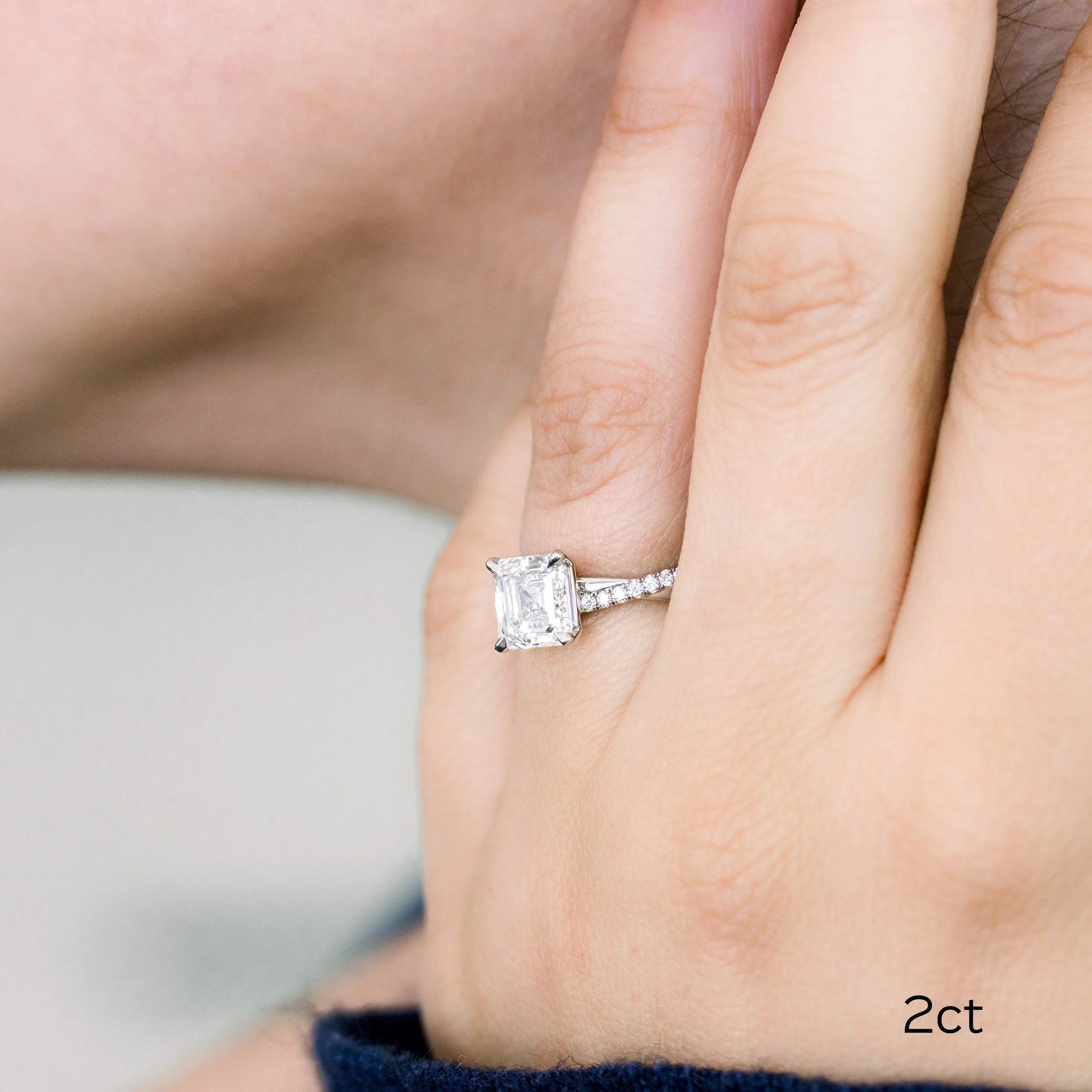 platinum 2 carat asscher cut lab diamond engagement ring with twisting diamond band ada diamonds design ad 154 on model