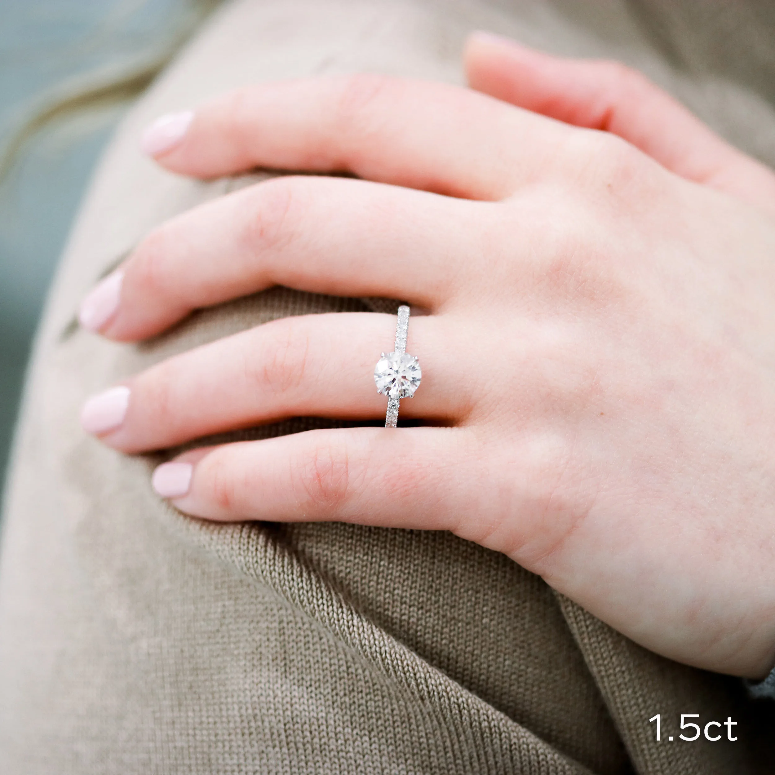 18k White Gold Diamond Engagement Ring featuring 1.5 Carat Round Lab Diamond and Diamonds on the Band Ada Diamonds Design 134 on Hand