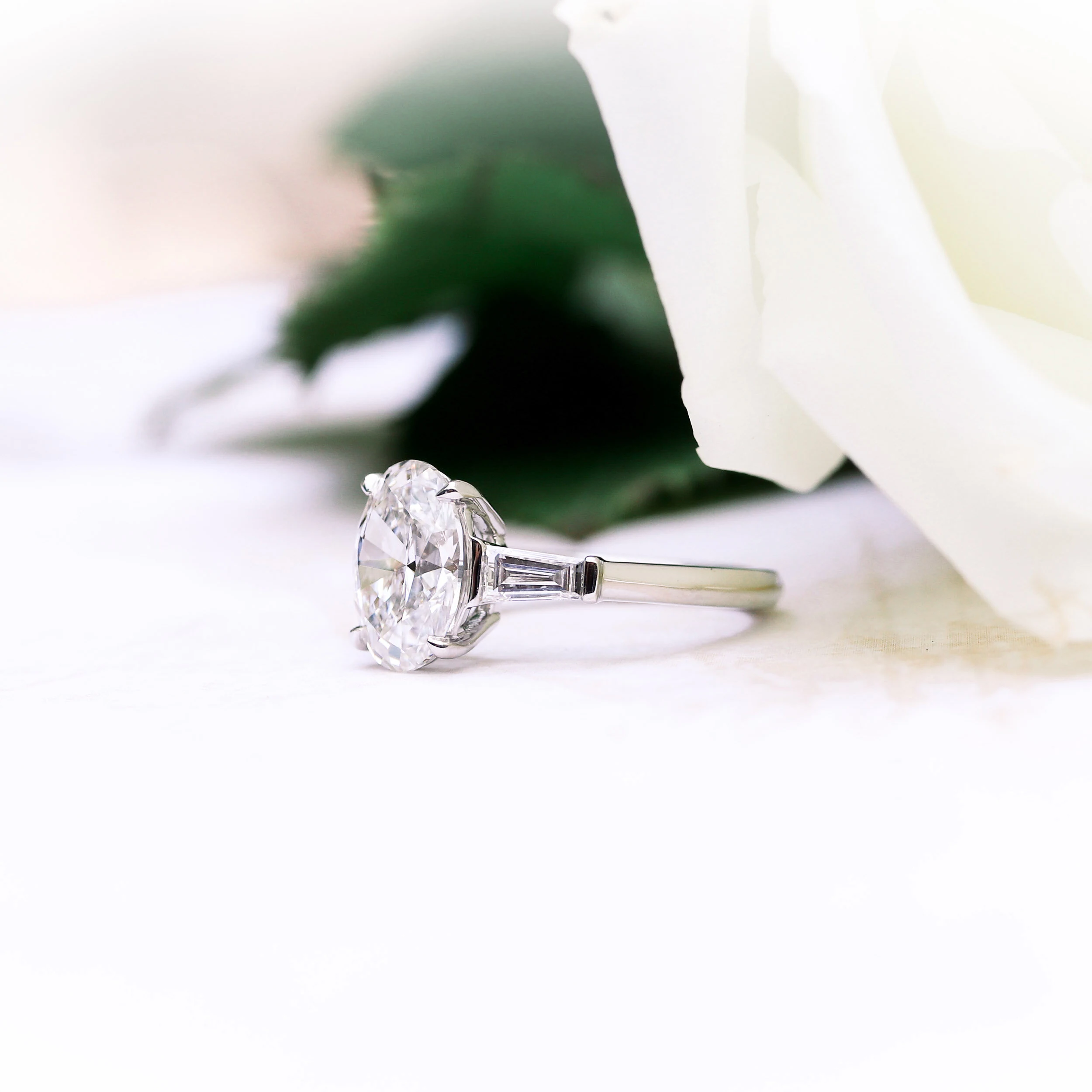 platinum engagement ring with oval and baguette lab grown diamonds ada diamonds design ad-459