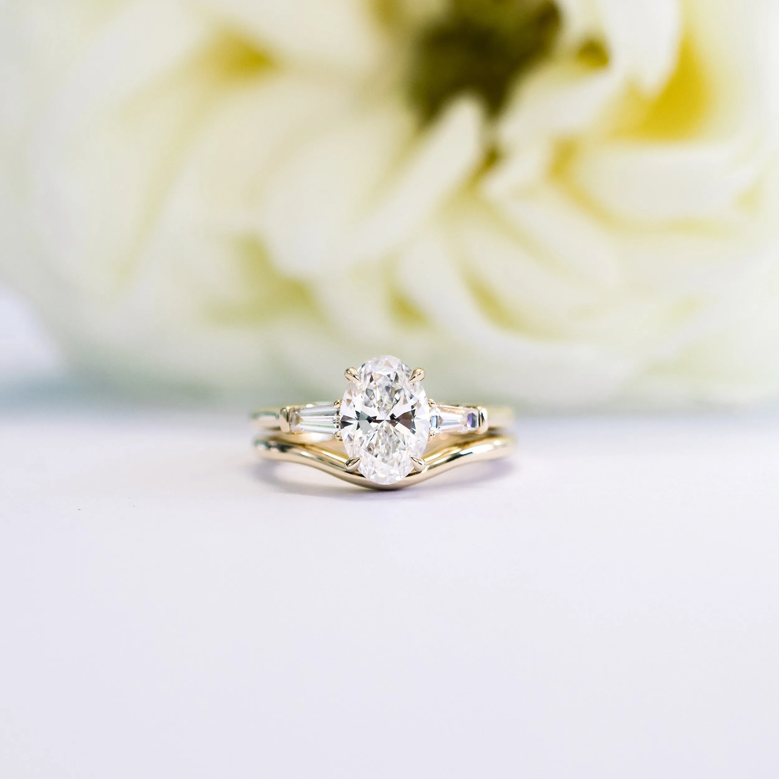yellow gold oval and baguette three stone lab grown diamond engagement ring with custom contour wedding band ada diamonds design ad 459 and ad 181