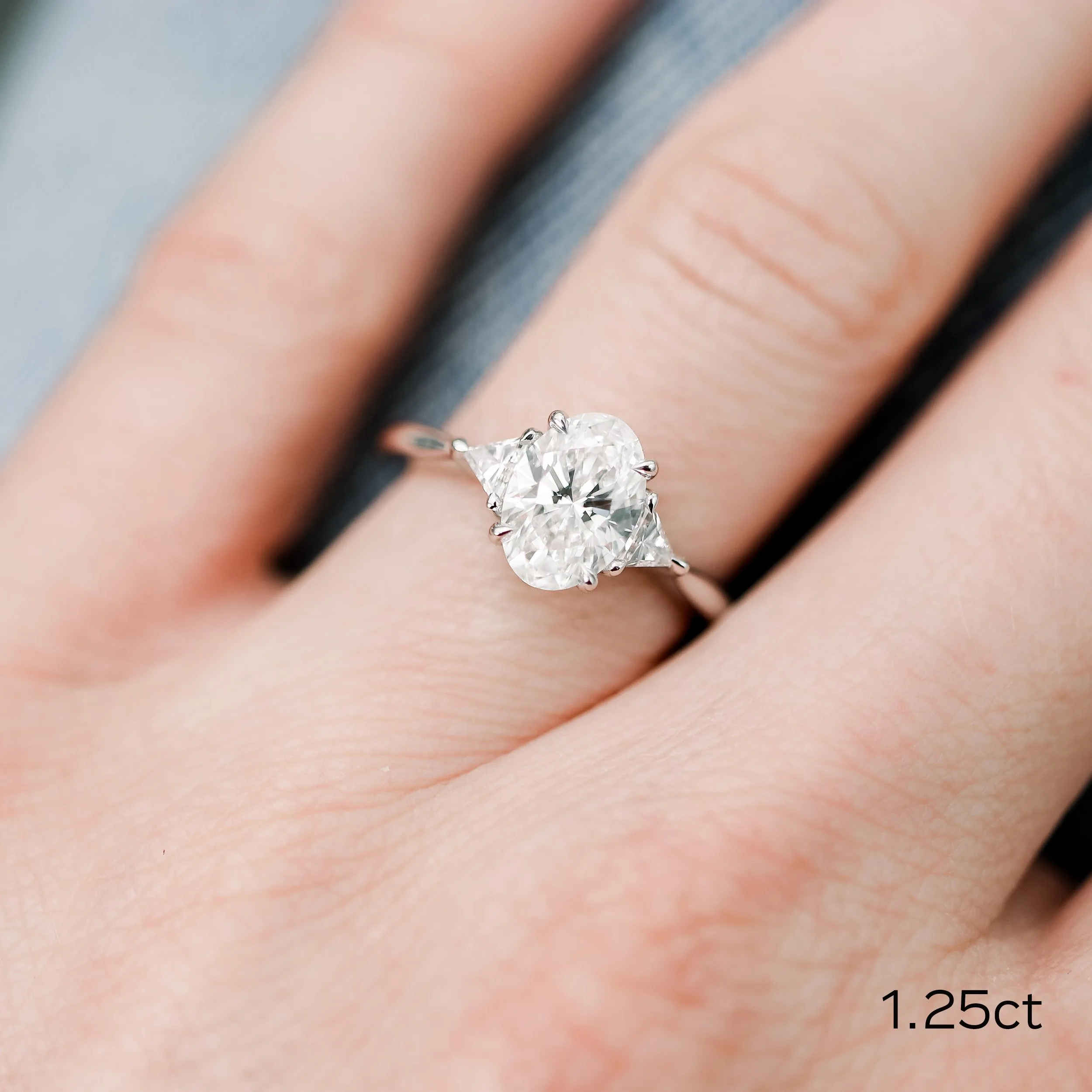 white gold 1.5ct oval and trillion three stone lab diamond engagement ring ada diamonds design ad 461 on model