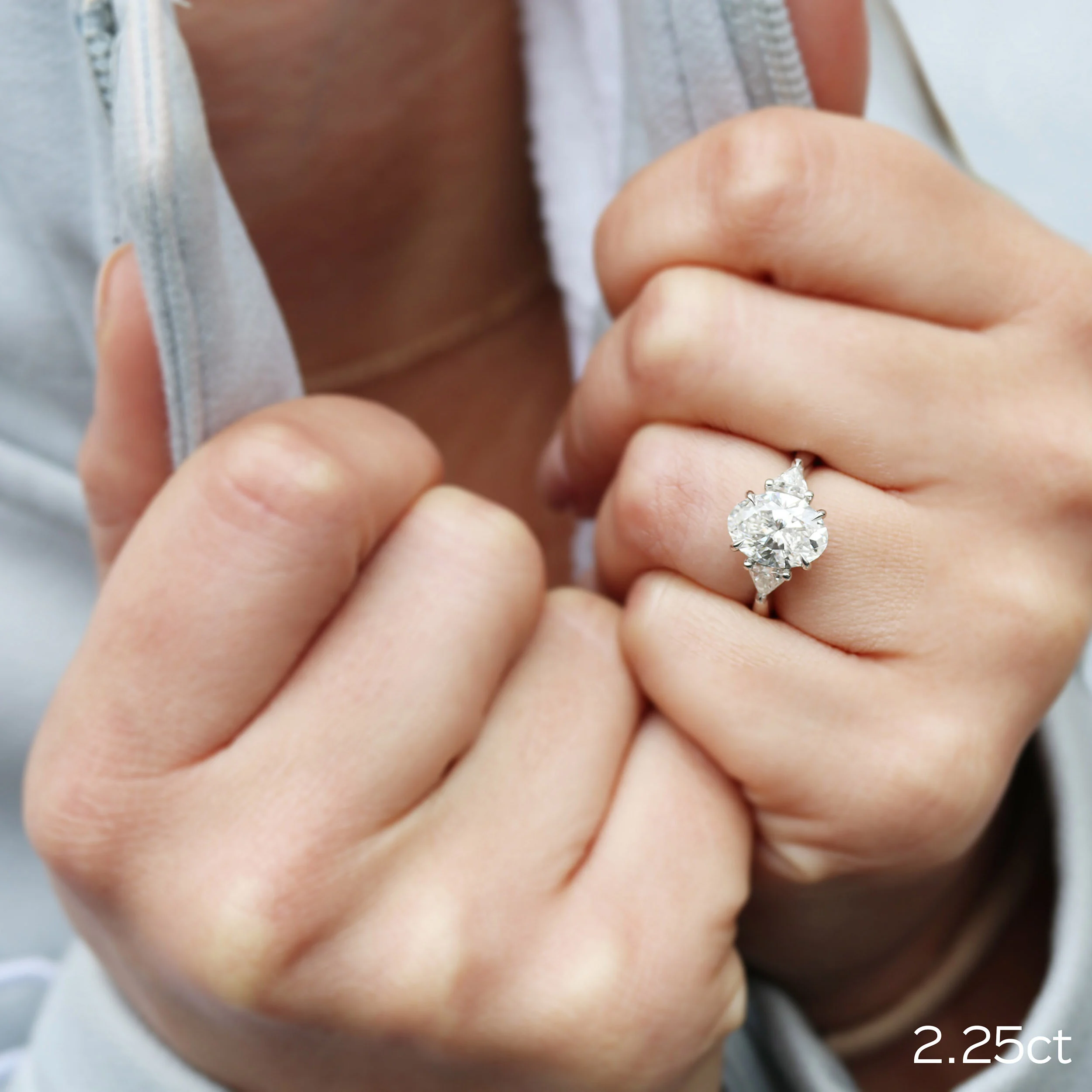 ada diamond 2.25ct oval lab grown diamond custom engagement ring featuring trillion side stones