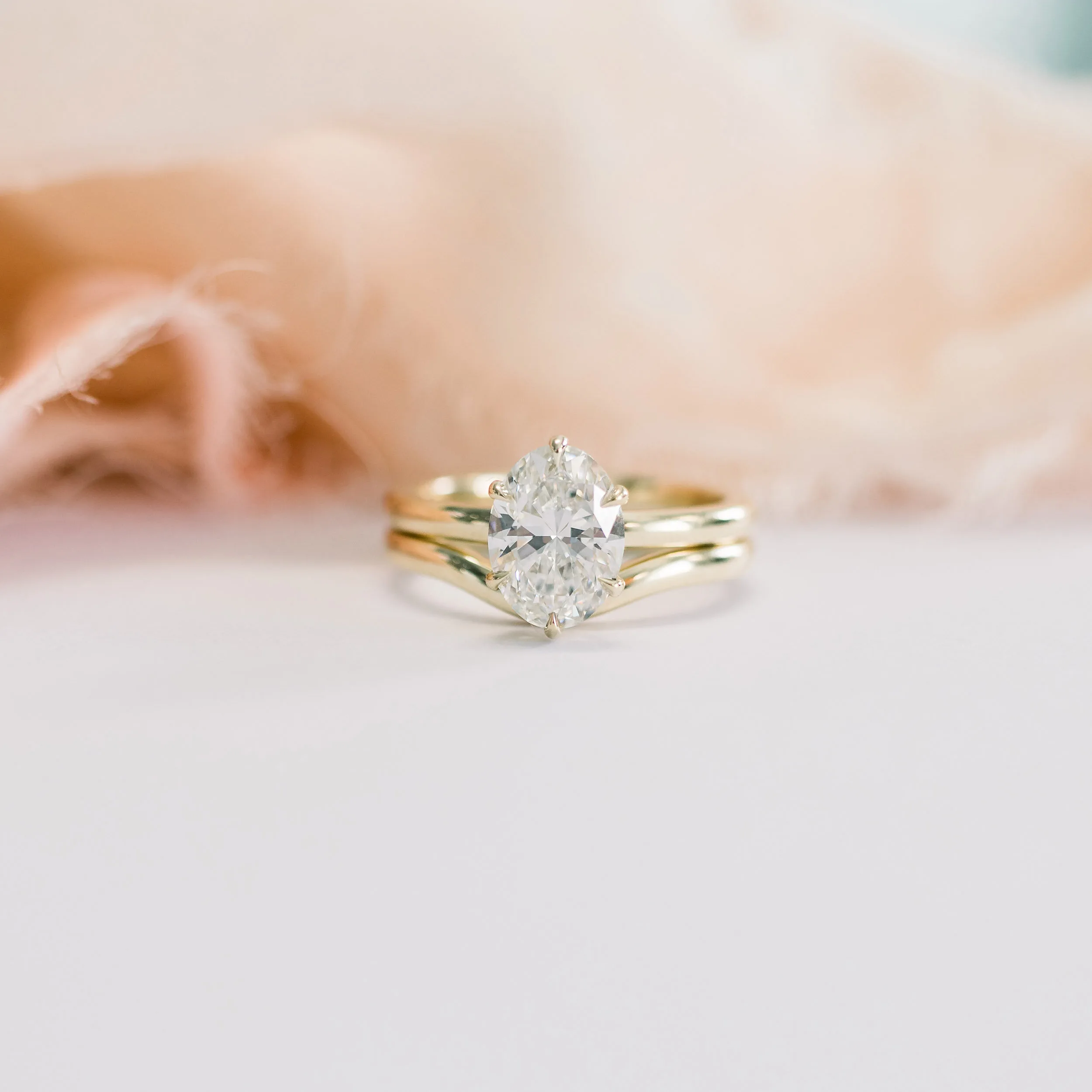 yellow gold wedding set with oval six prong solitaire