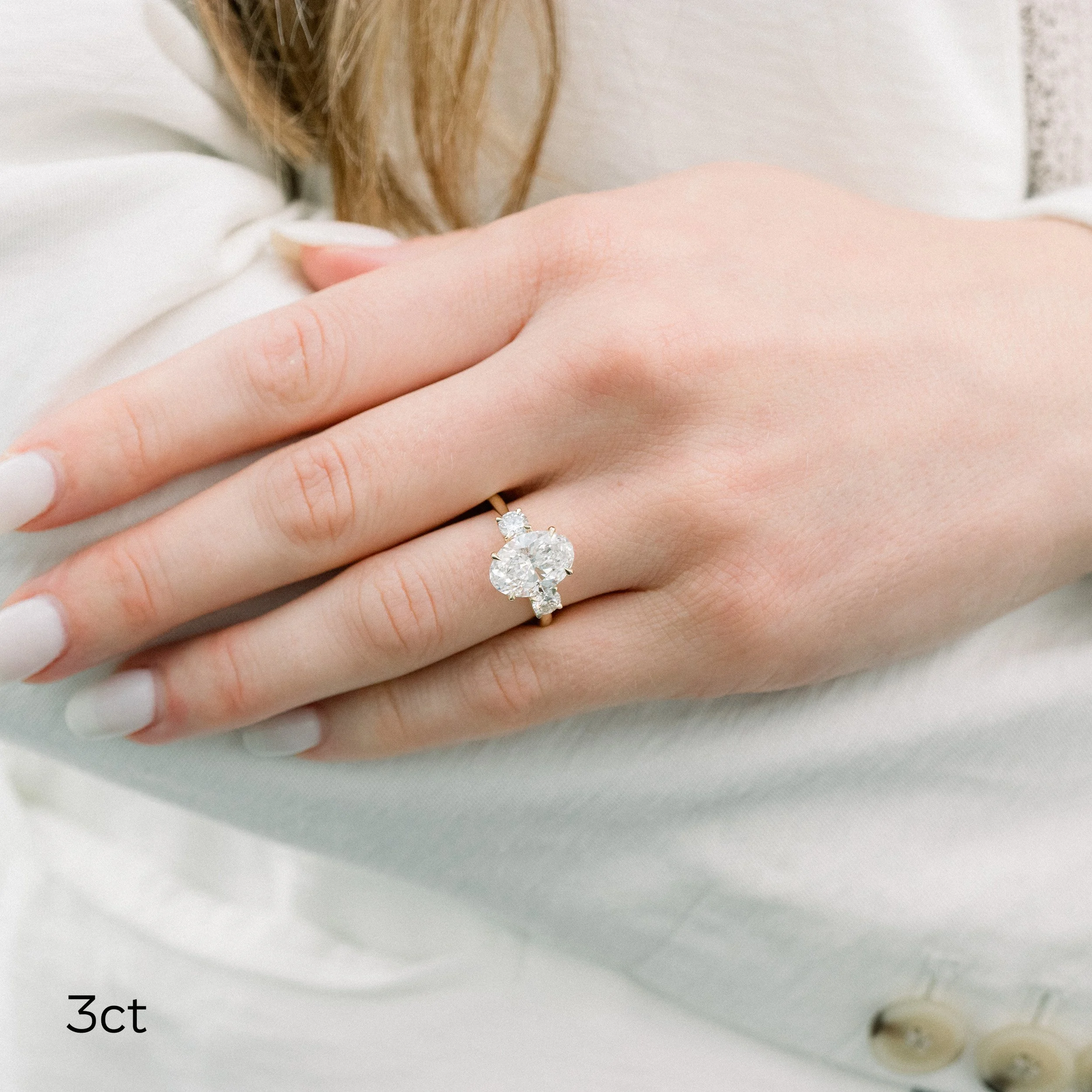 14k yellow gold 3 carat oval and round lab diamond three stone engagement ring ada diamonds design ad 458 on model