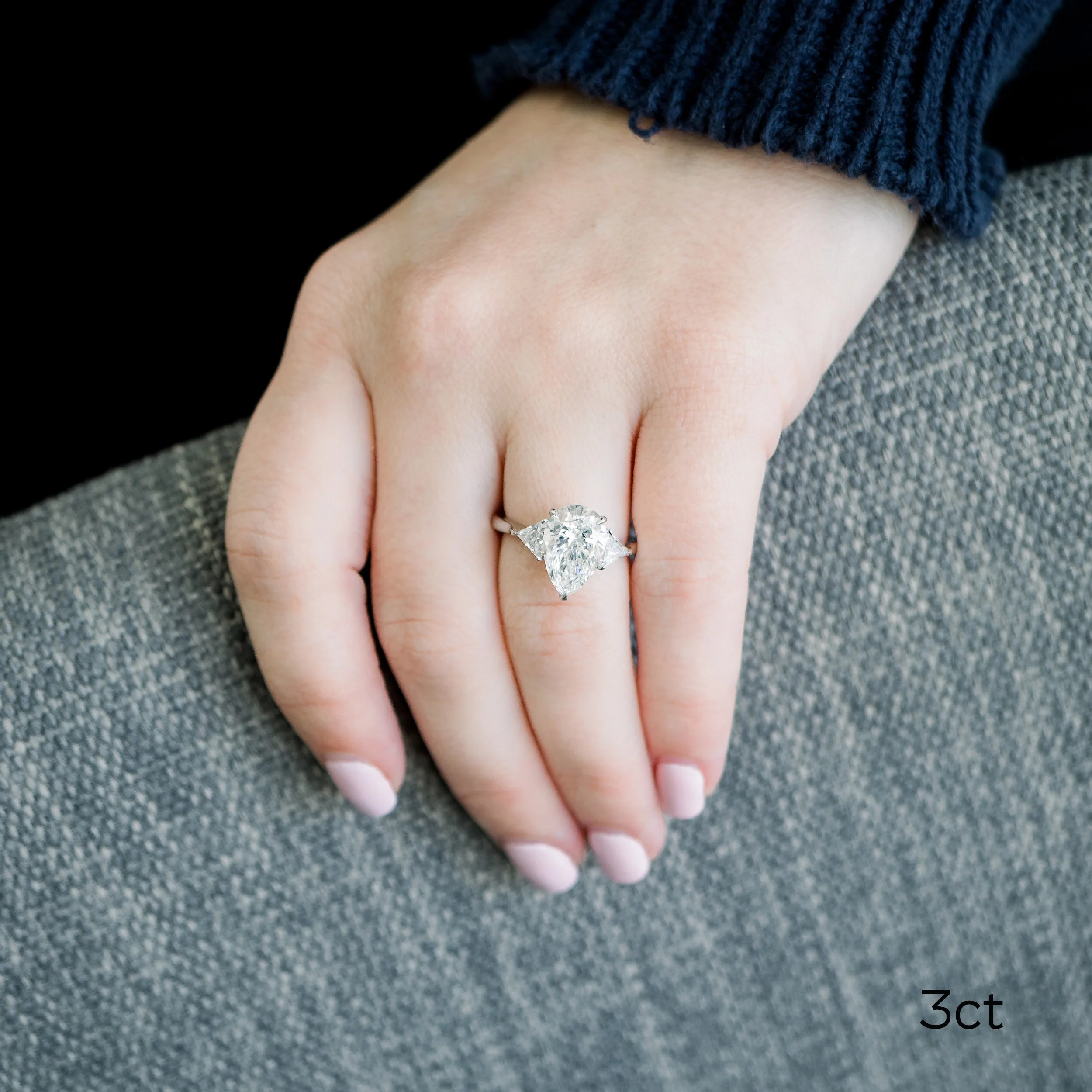 platinum three stone engagement ring with three carat pear lab diamond center stone ada diamonds design ad496 on model