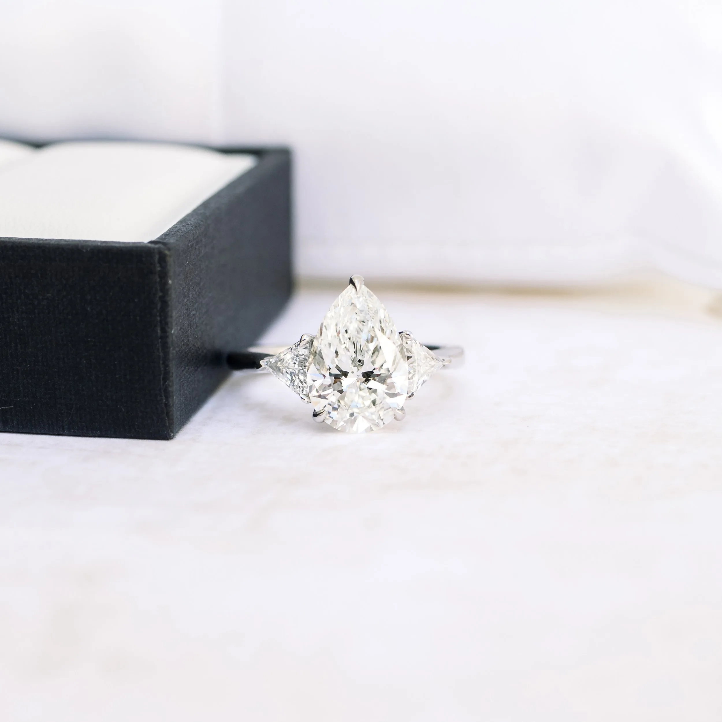 platinum 3.5 carat pear lab diamond engagement ring with triangular side stones ada diamonds design ad 496