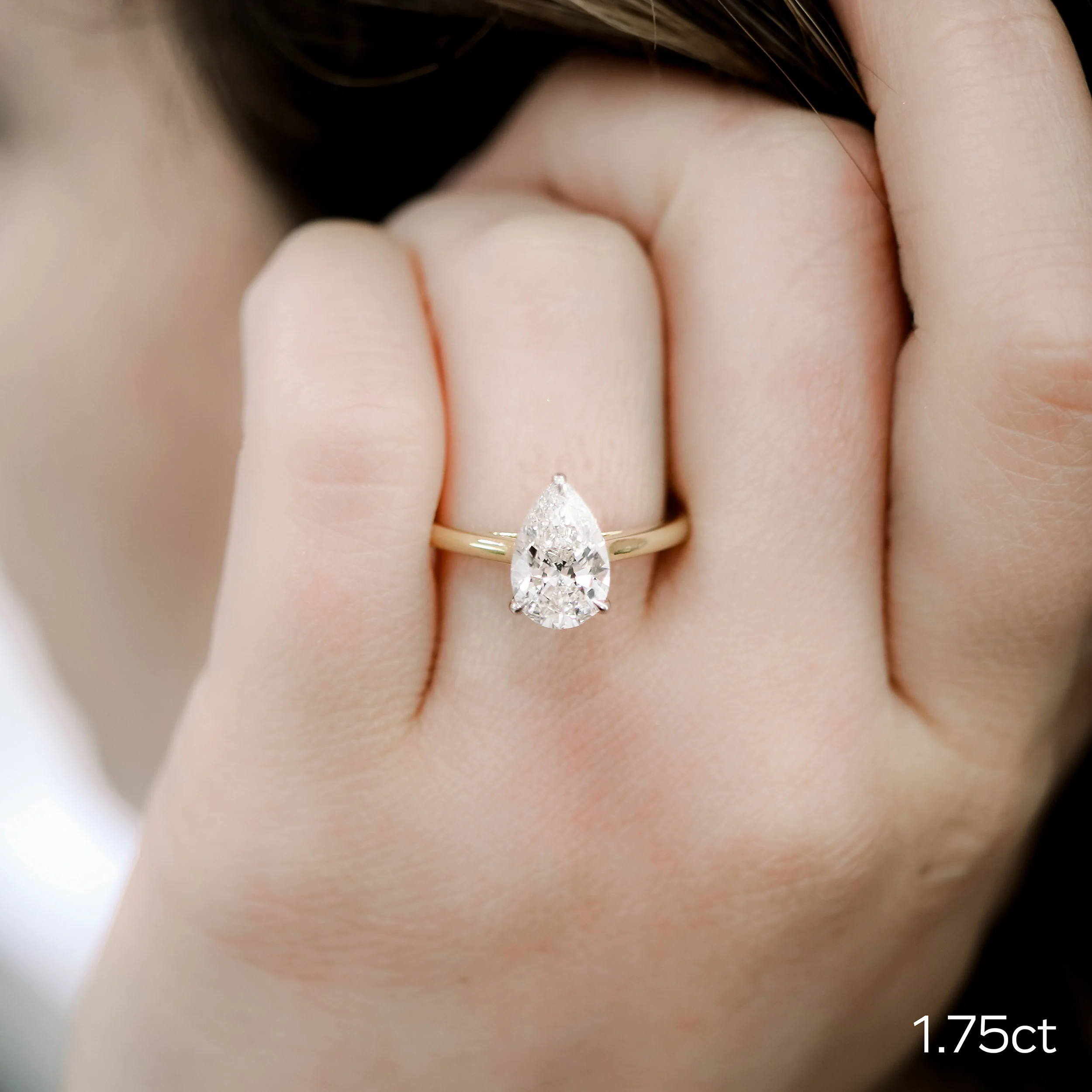 2ct pear solitaire in two tone yellow gold and platinum