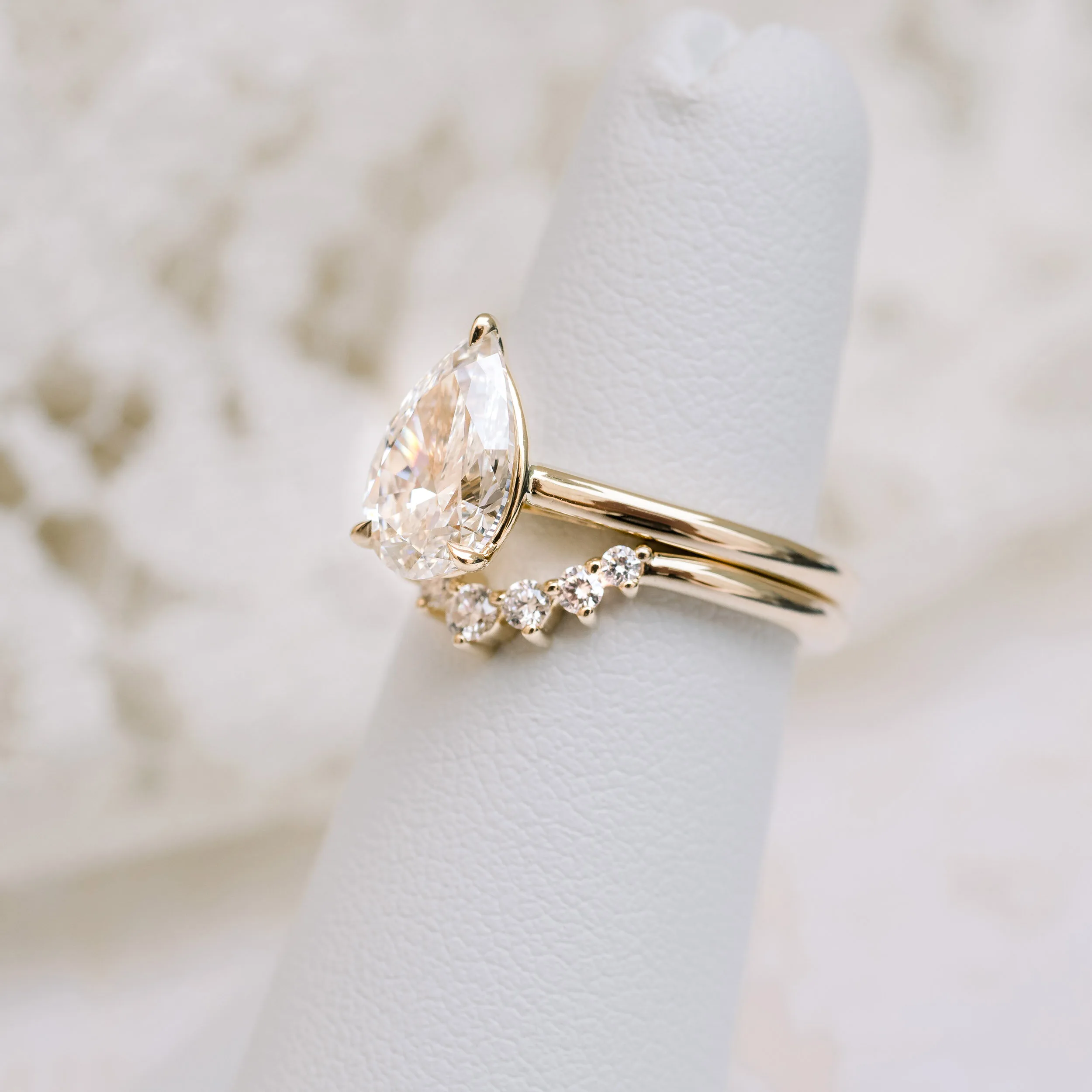 yellow gold pear cathedral solitaire with nesting band