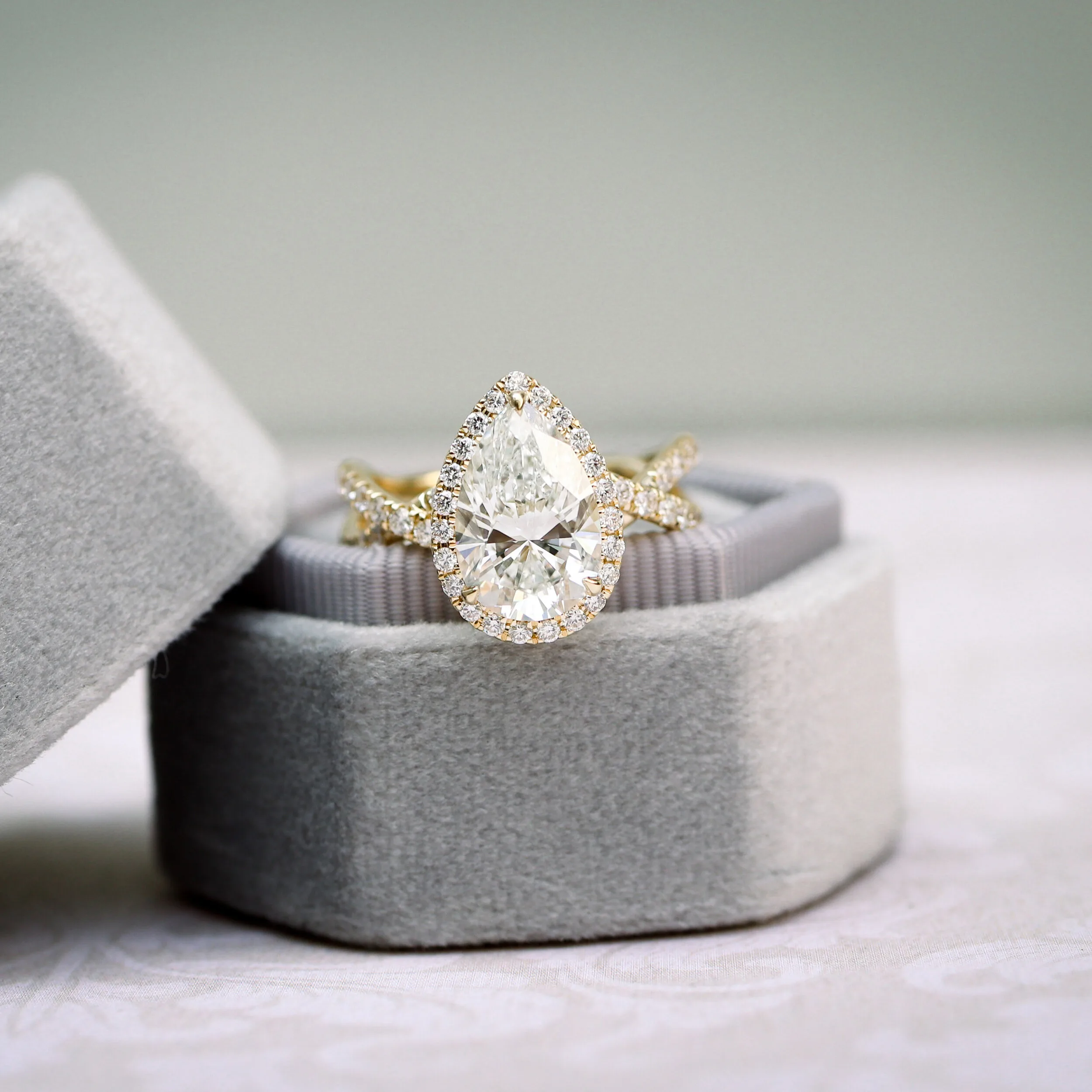 18k Yellow Gold Custom 3 Ct Pear Lab Created Diamond Halo Engagement Ring with Twisting Diamond Band Ada Diamonds Design AD-179 Macro