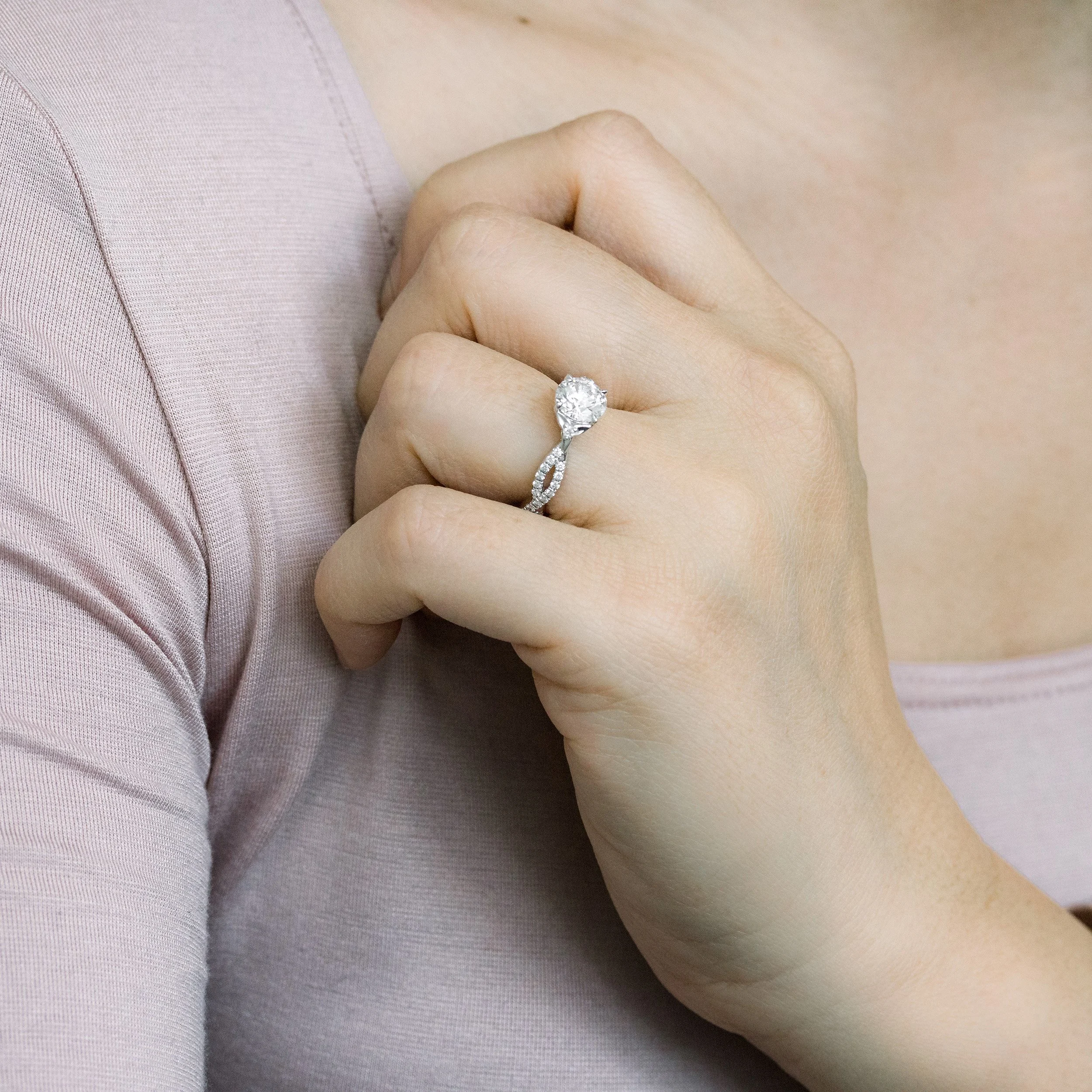 white gold custom lab diamond engagement ring with round center stone and twisting diamond band ada diamonds design ad-178