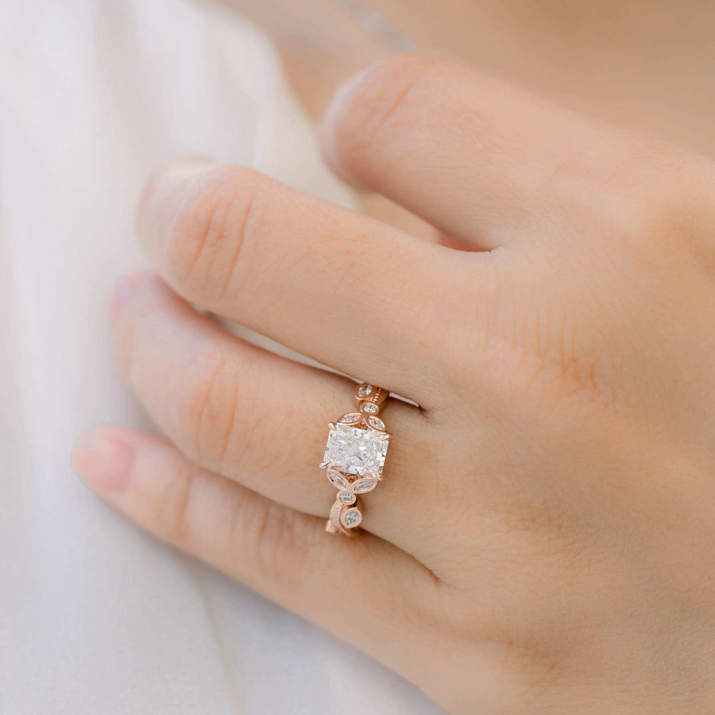 14k Rose Gold 1.5 Carat Radiant Lab Diamond Engagement Ring with Leaf Inspired Band of Marquise and Round Lab Diamonds Ada Diamonds Design AD-178 On Hand