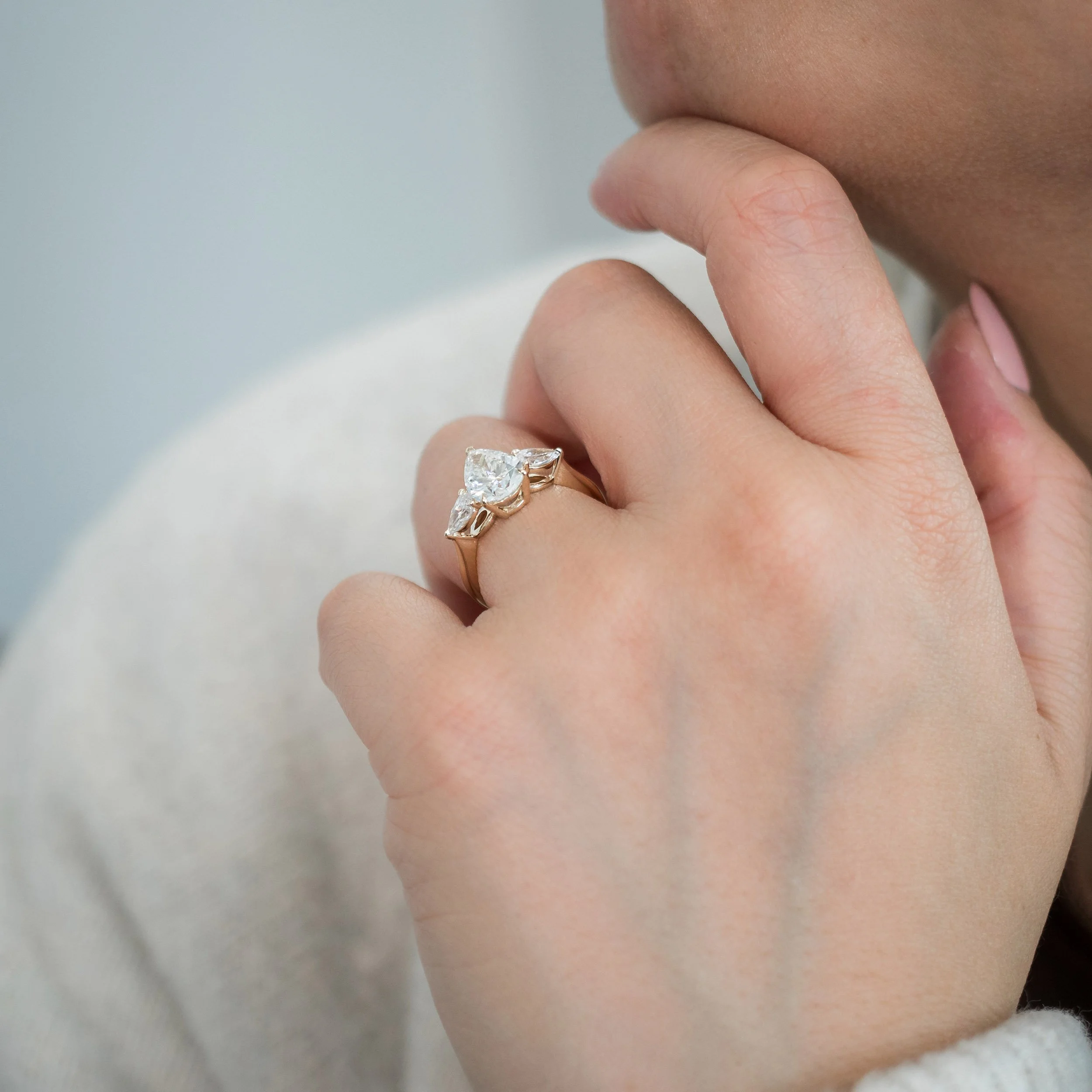 on model profile view of 2.5ct pear three stone lab diamond engagement ring ada diamonds design ad 218 on model