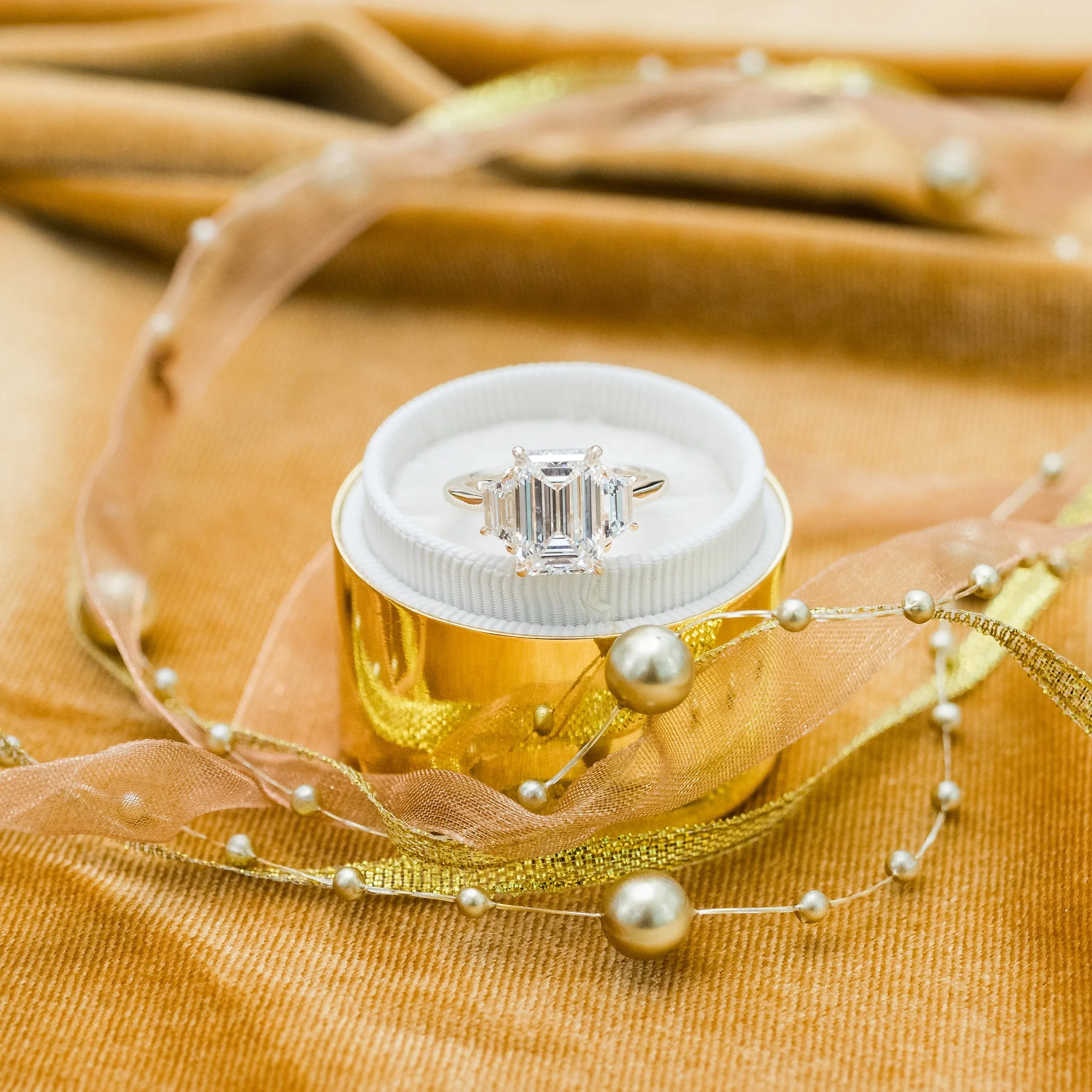 14k yellow gold 4 carat emerald cut and trapezoid lab diamond three stone engagement ring ada diamonds design ad 465 macro
