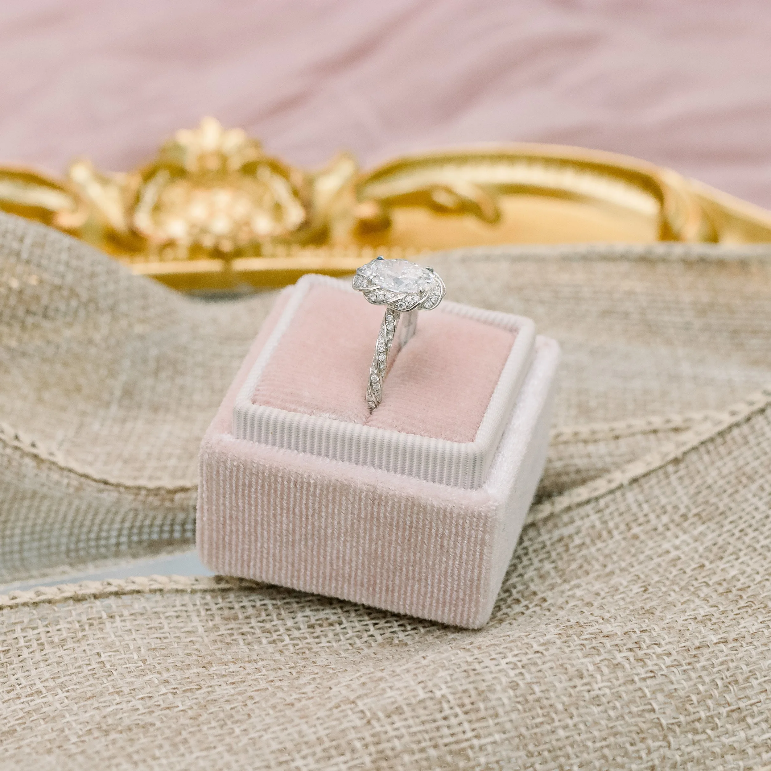 18k white gold 1.25 ct oval lab diamond in custom setting with twisting halo and twisting diamond band ada diamonds design ad 179 profile