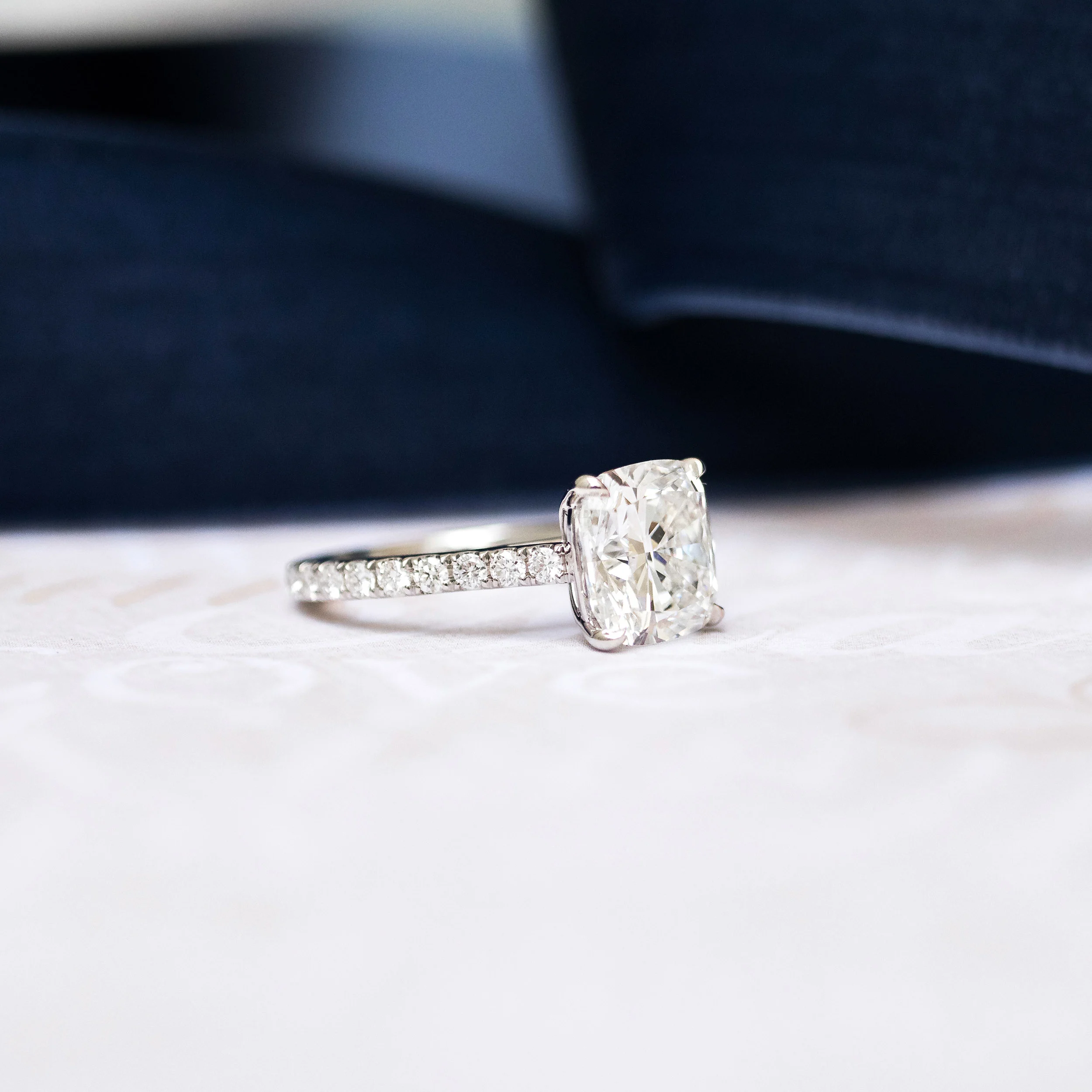 Platinum Cushion Cathedral Pavé Diamond Engagement Ring featuring 3.25 Carat Lab Diamonds (Profile View)