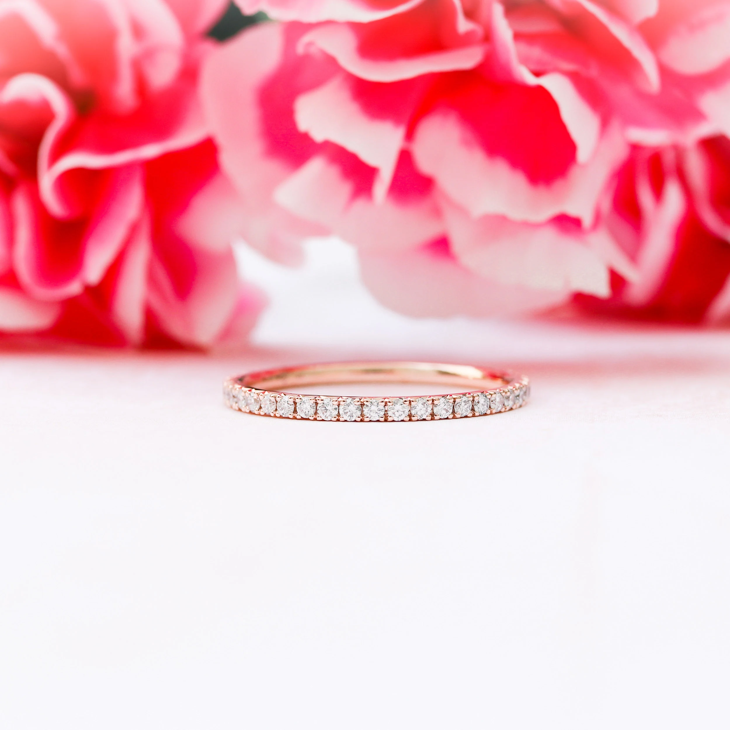 14kt Rose Gold French Pavé Eternity Band in 14k Rose Gold 0.6ctw featuring 0.6 Carat Round Brilliant Diamonds (Main View)