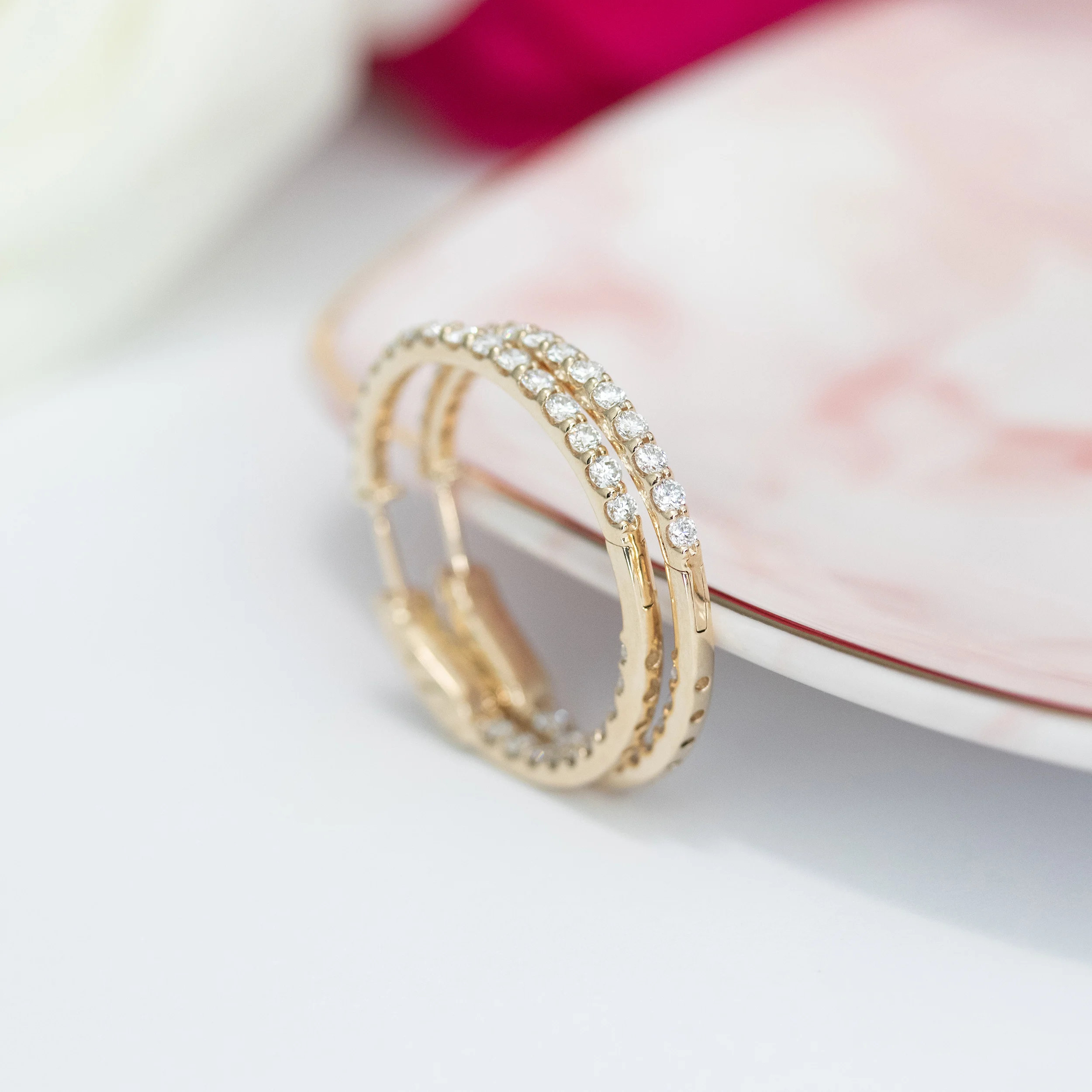 14 Karat Yellow Gold 1.75ctw Inside Out Diamond Hoop Earrings in 14k Yellow Gold featuring Hand Selected 1.75 ctw Round Diamonds (Profile View)