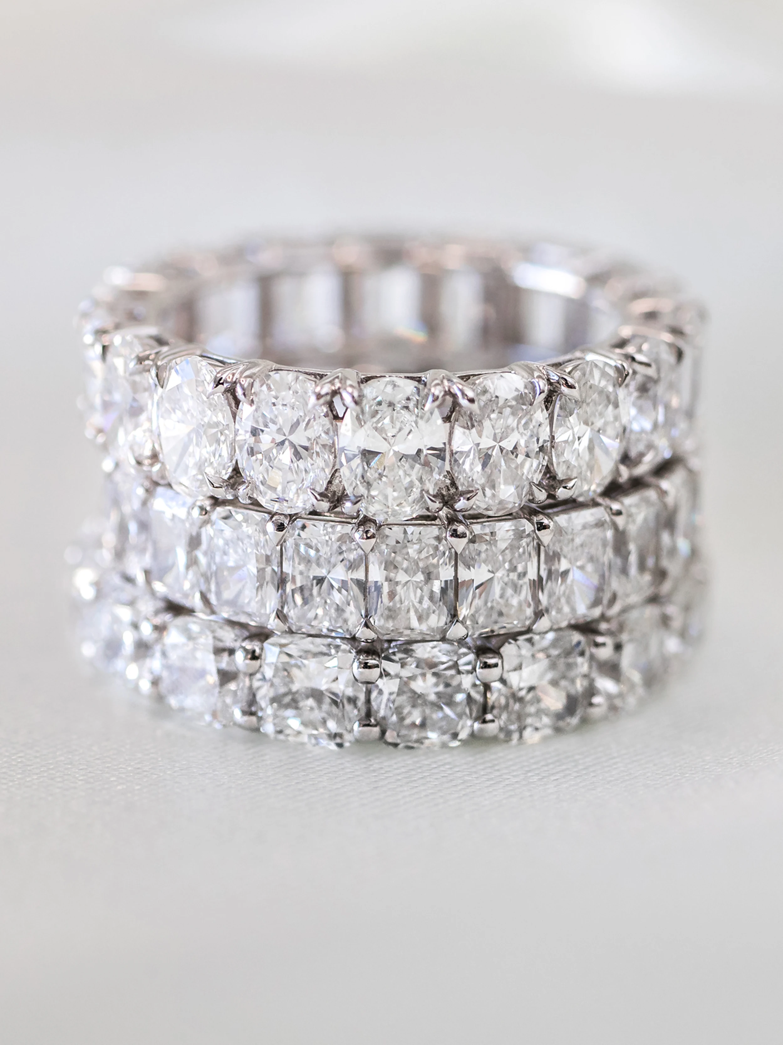 High Quality Created Diamonds set in Oval Diamond French U Eternity Band (Profile View)