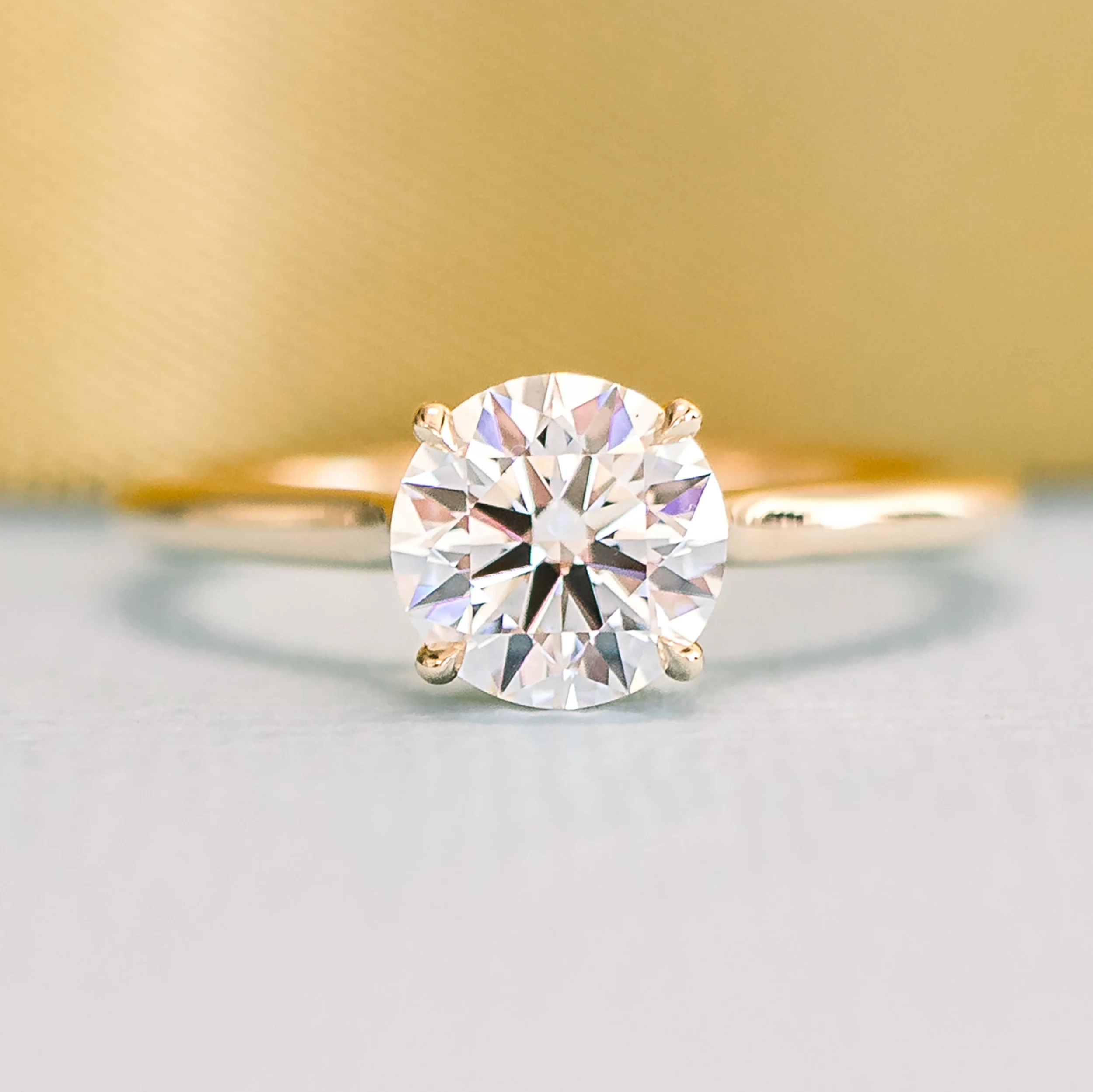 Round Trellis Solitaire featuring Hand Selected Synthetic Diamonds (Profile View)