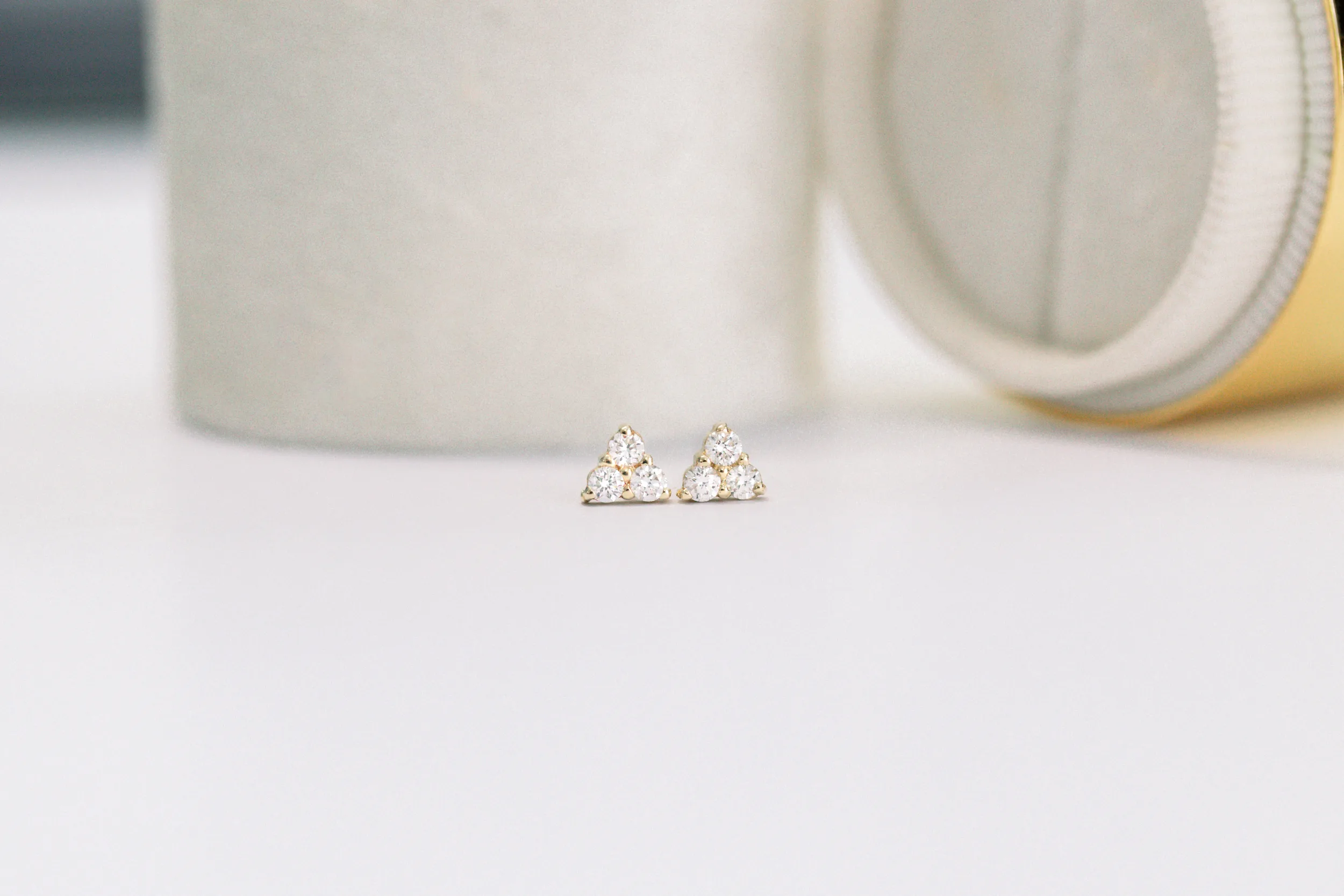 14k Yellow Gold 0.18ctw Three Stone Diamond Earrings in 14k Yellow Gold featuring Hand Selected 0.18 Carat Round Diamonds (Main View)