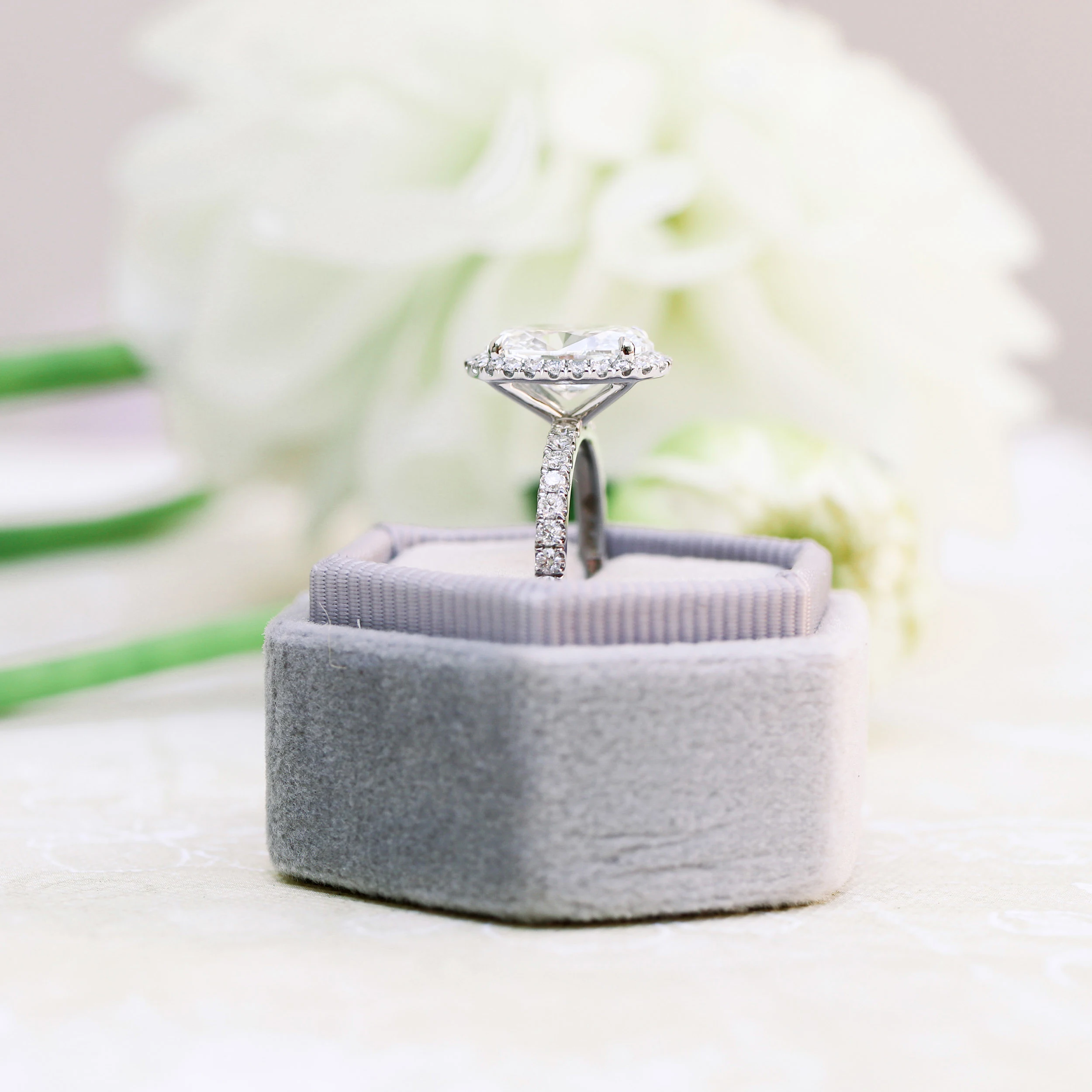 Platinum Oval Halo Pavé Diamond Engagement Ring featuring 2.75 ctw Man Made Diamonds (Side View)