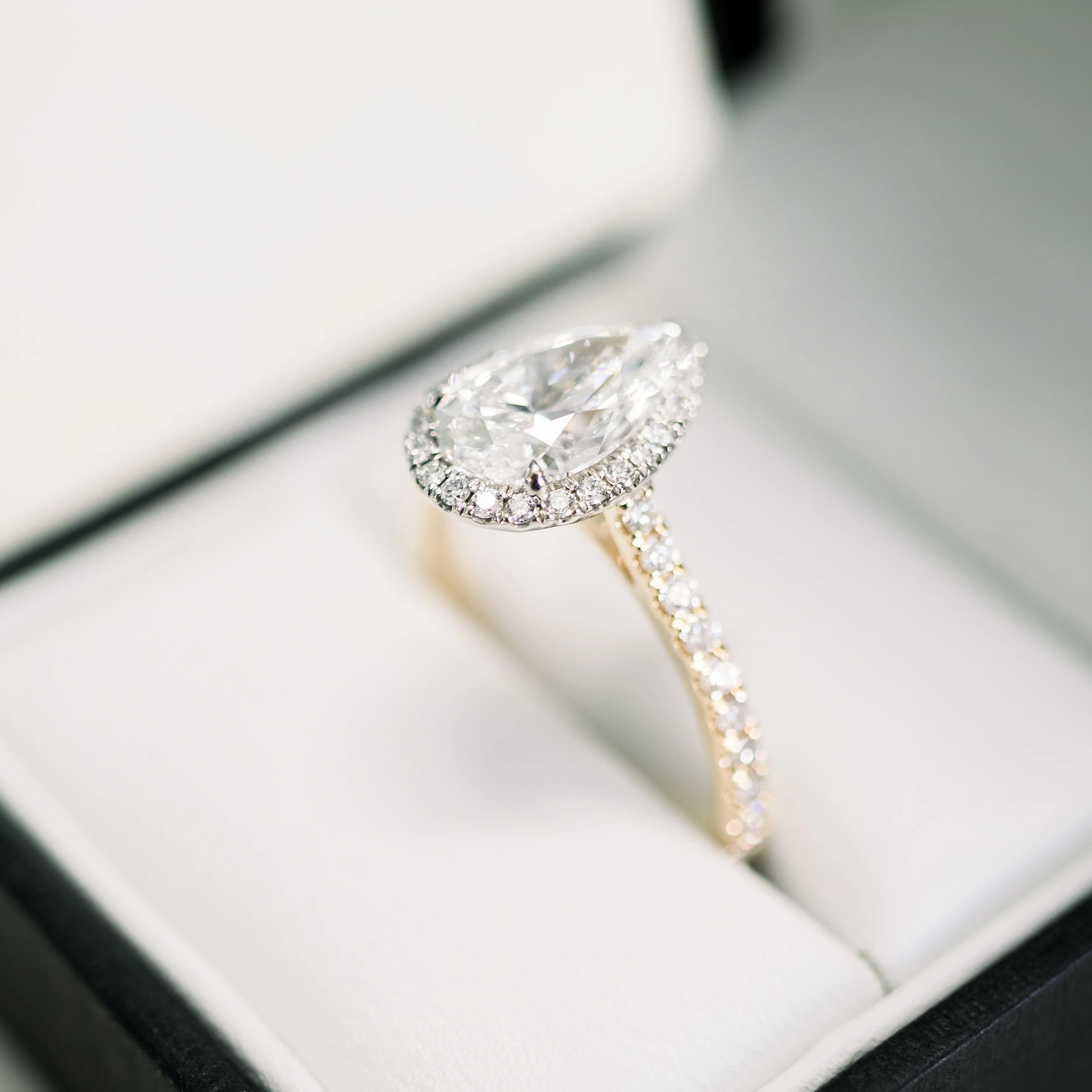 Platinum & Yellow Gold Pear Halo Pavé Setting featuring 2.0 Carat Lab Diamonds (Side View)