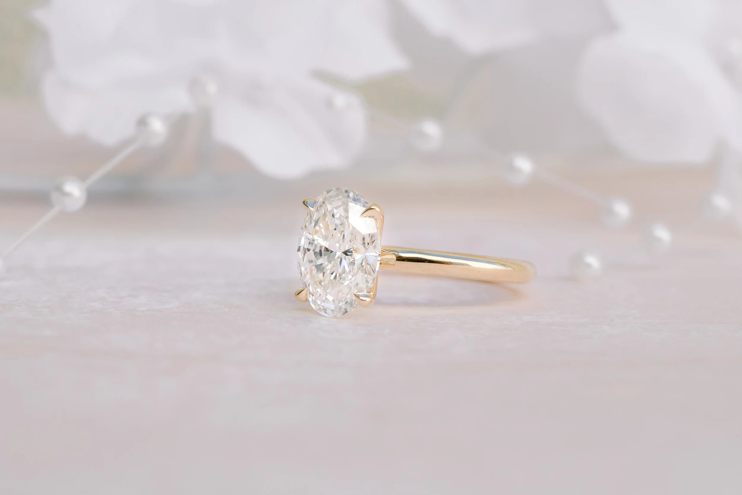 Yellow Gold Oval Classic Four Prong Solitaire Diamond Engagement Ring featuring 2.25 Carat Lab Diamonds (Side View)