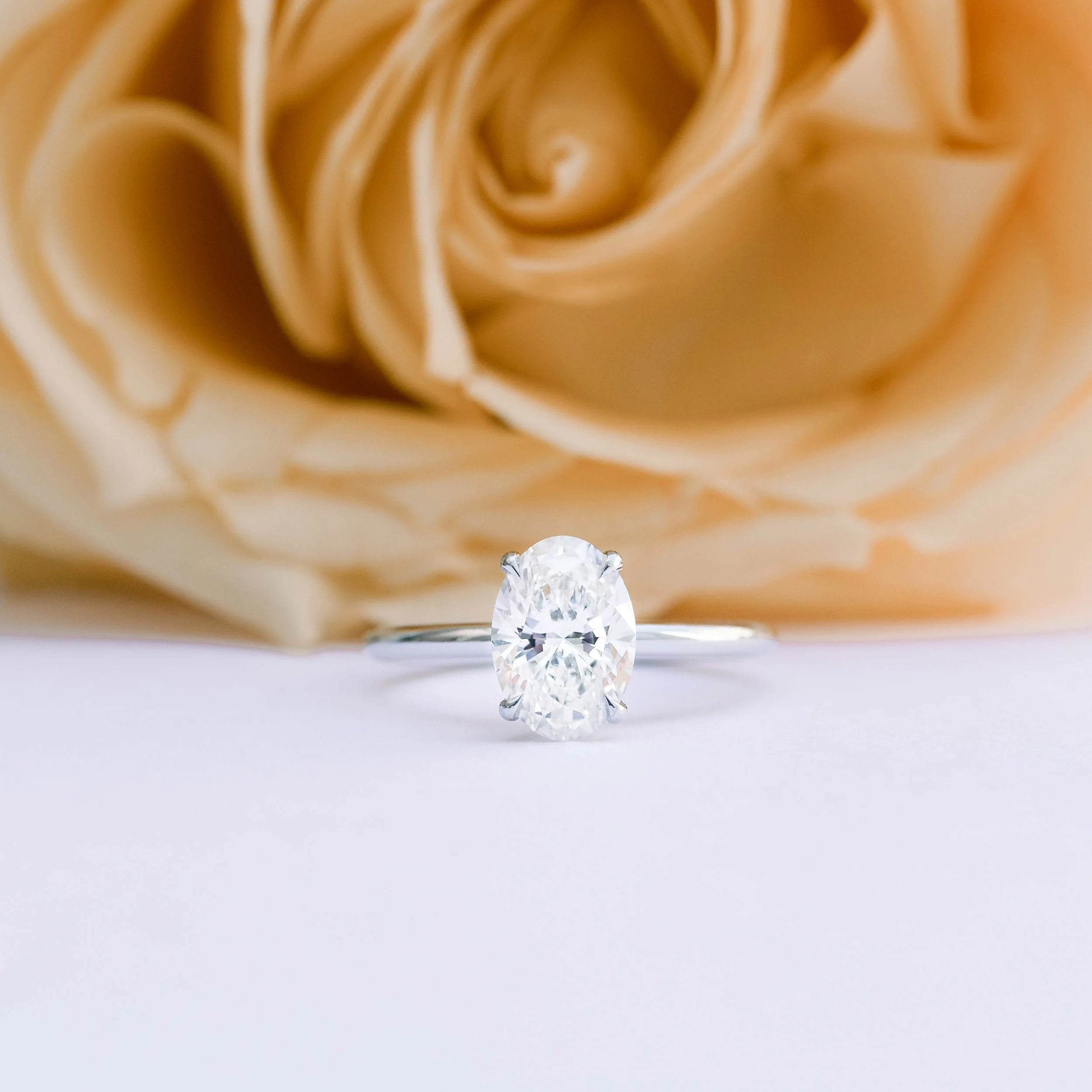 Platinum Oval Classic Four Prong Solitaire Diamond Engagement Ring featuring 1.75 Carat Synthetic Diamonds (Main View)