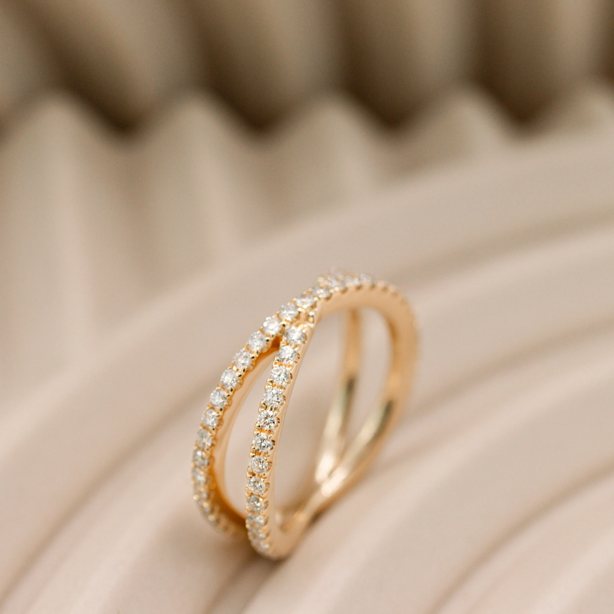 0.6 Carat Round Lab Diamonds set in 14k Yellow Gold X Wedding Band (Profile View)