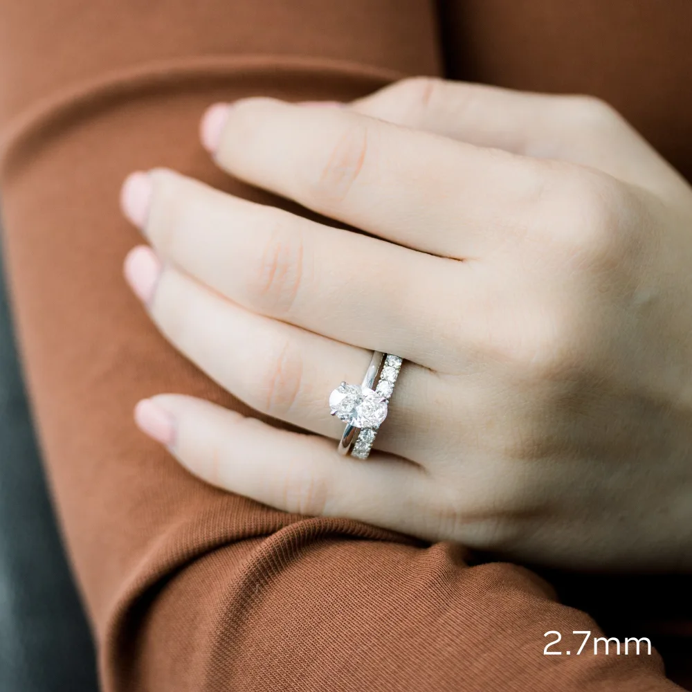 lab diamond wedding set with oval solitaire and french pavé man made diamond 3/4 band in white gold ada diamonds design ad 175 on model
