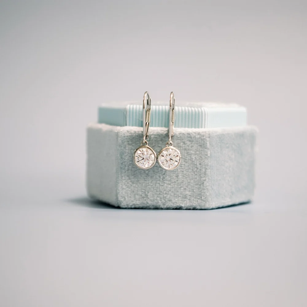 platinum round bezel set lab grown diamond earrings ada diamonds design ad 005
