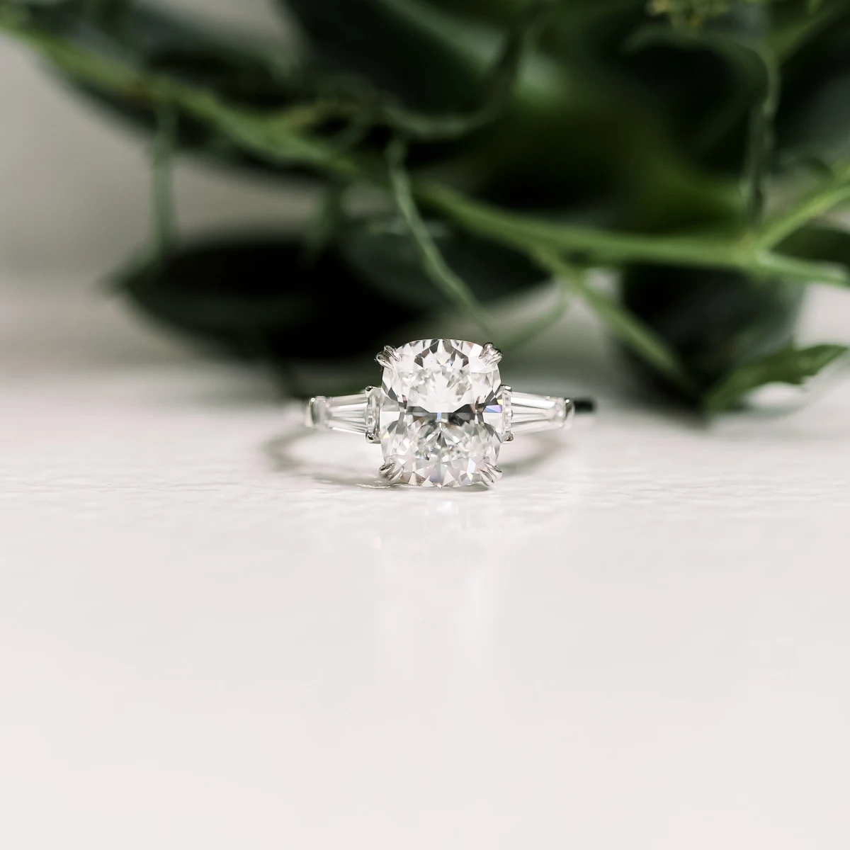 https://content.adadiamonds.com/image/upload/f_webp,w_2500/f_webp,w_1200/v1691556867/cushion-lab-diamond-three-stone-ring_1633295731205-0AT1TB3YKPI60XIZRRDP.jpg