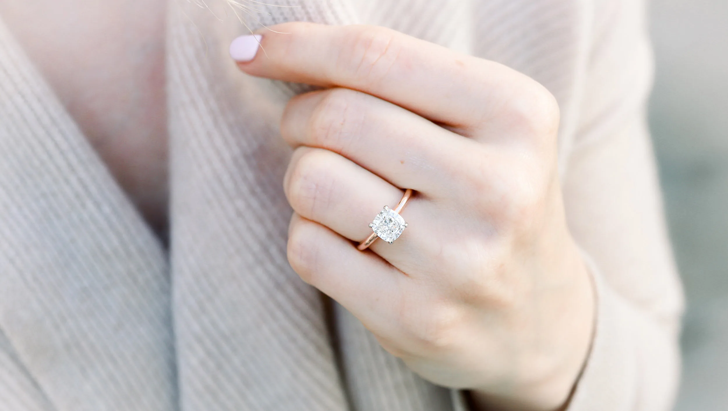cushion cut engagement ring in rose gold with lab grown diamond