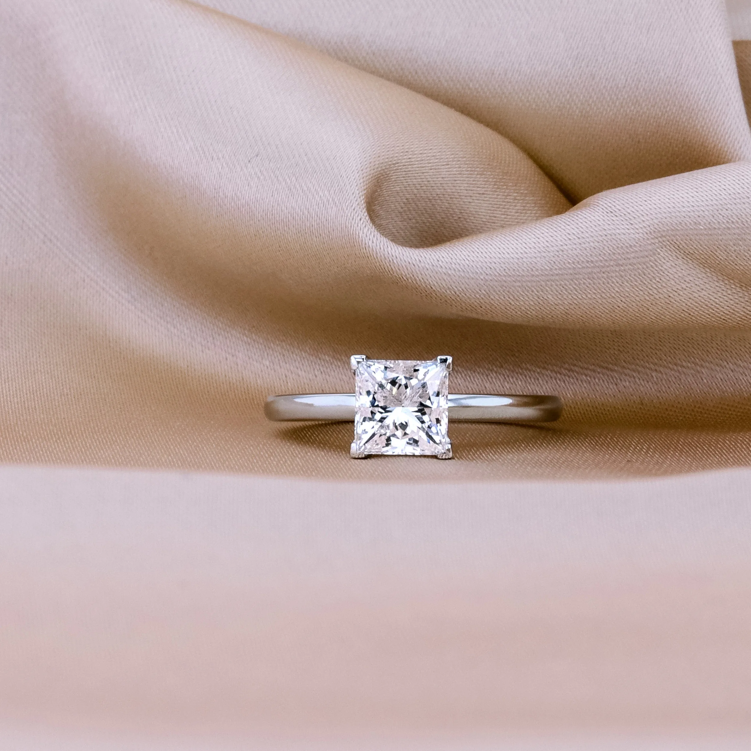 High Quality 1.5 Carat Lab Diamonds set in Platinum Princess Petite Four Prong Solitaire Diamond Engagement Ring (Profile View)